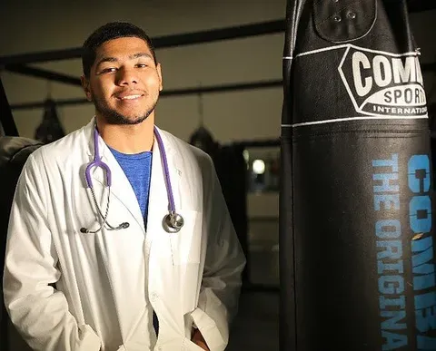 A PVAMU student in a lab coat